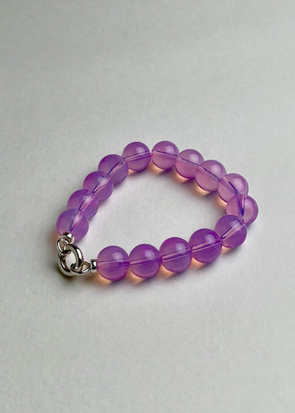 Front view of a deep pink Opalite beaded chainlet with looped Sterling Silver endings closed with connector on a white background