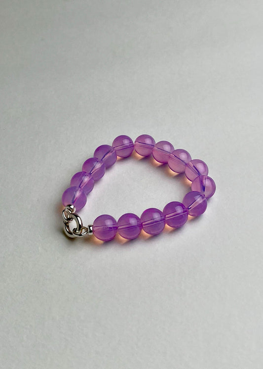 Front view of a deep pink Opalite beaded chainlet with looped Sterling Silver endings closed with connector on a white background