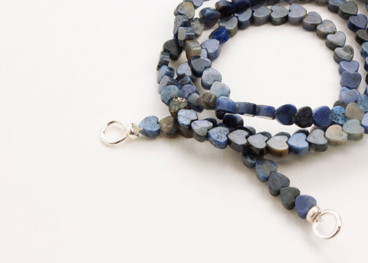 Front view of Sterling Silver endings of a Lapis Lazuli heart bead necklace on a white background 