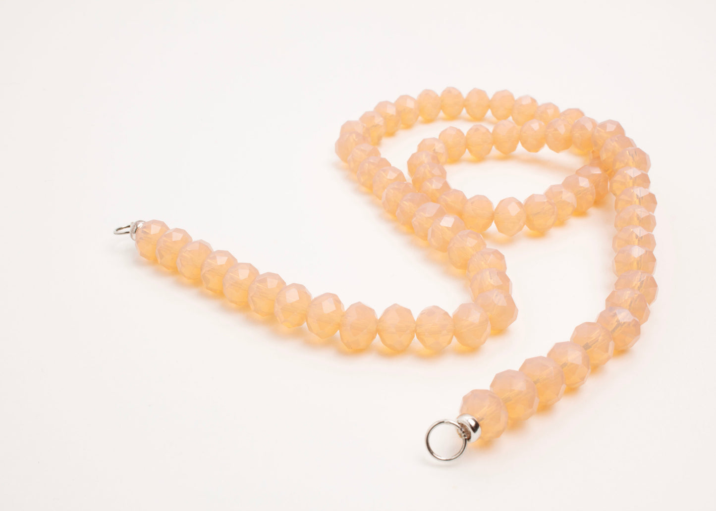 Sterling Silver endings details of a peach_glass_beads_strand_open_endings_detail