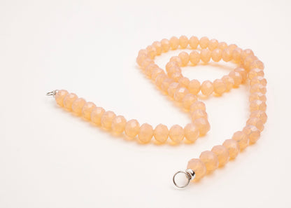 Sterling Silver endings details of a peach_glass_beads_strand_open_endings_detail