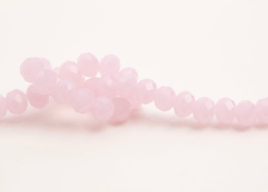 Front_view of a pink_rondelles_glass_bead_strand_knotted_on a white background.