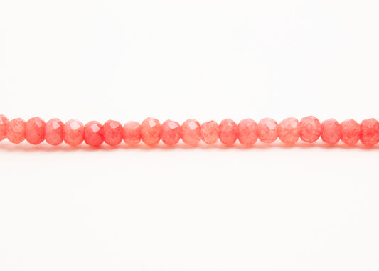Front horizontal detail of beads view of a rose_small_quartzite_bead_strand on white background