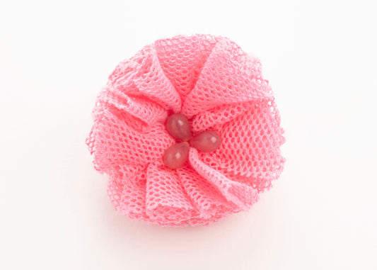 Front view of a rose point de tulle flower charm with glass bead detail on a white background