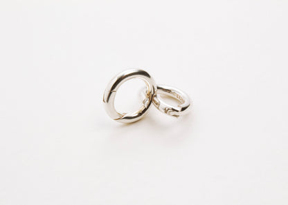 Front view of two Sterling Silver Spring Gate locks one closed and one open on a light grey background