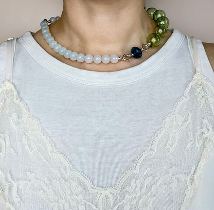 Front view of an green blue opaline necklace on a round neck line with blue top spinner charm and green chunky glass bead chainlet with Sterling Silver endings