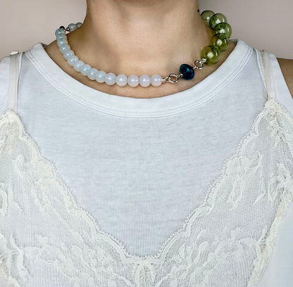 Front view of a ready to wear necklace made with  green blue opalite placed on a round neck line with blue glass top charm and pink chunky glass bead chainlet with Sterling Silver endings