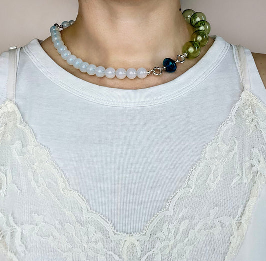 Front view of a ready to wear necklace made with  green blue opalite placed on a round neck line with blue glass top charm and pink chunky glass bead chainlet with Sterling Silver endings